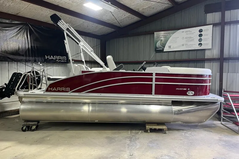 The Image of 2026 Harris Cruiser 190 CS pontoon boat in a warehouse setting. - 1