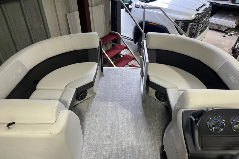 Slide: The Image of 2026 Harris Cruiser 190 CS interior with plush seating and modern dashboard. - 4