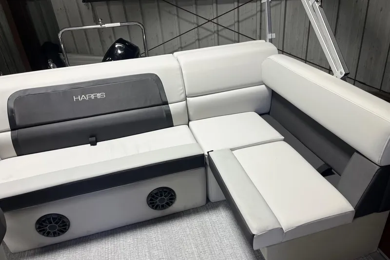 Slide: The Image of 2026 Harris Cruiser 190 CS boat interior with white and gray seating. - 6