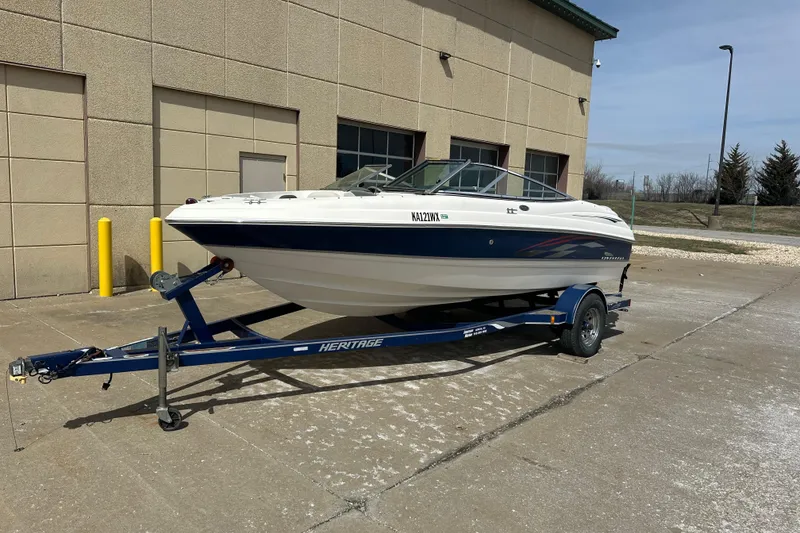 Slide: The Image of 2004 Chaparral 190 SSi boat on trailer outside a building. - 2