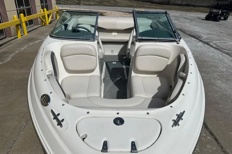 Slide: The Image of 2004 Chaparral 190 SSi boat interior with seating and steering wheel. - 6