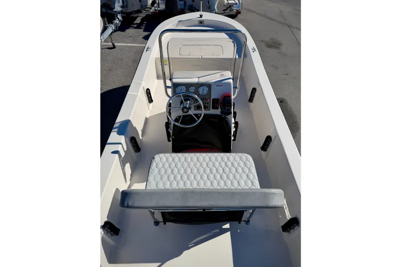 Slide: The Image of 2026 Carolina Skiff E20 JVX CC boat interior with steering console and seating. - 12