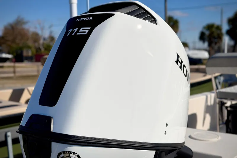 Slide: The Image of Honda 115 outboard motor on 2026 Carolina Skiff E20 JVX CC boat. - 4