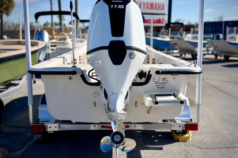 Slide: The Image of 2026 Carolina Skiff E20 JVX CC boat with Honda 115 outboard motor. - 5