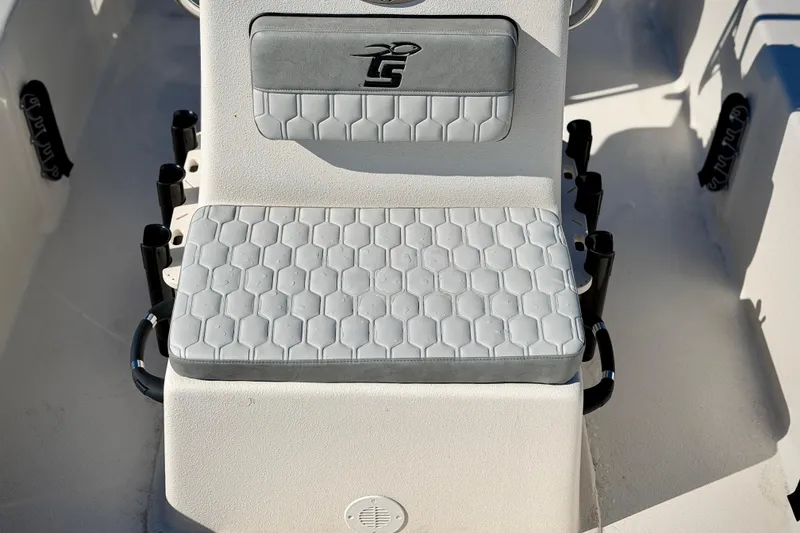 Slide: The Image of 2026 Carolina Skiff E20 JVX CC boat seat with hexagonal pattern and logo. - 9