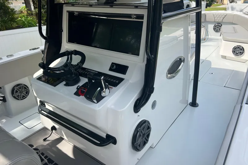 Slide: The Image of 2018 Contender 39 ST boat cockpit with modern controls and sleek design. - 10