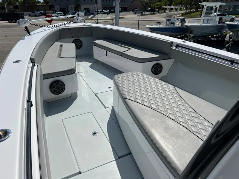 Slide: The Image of Interior view of a 2018 Contender 39 ST boat with cushioned seating. - 11
