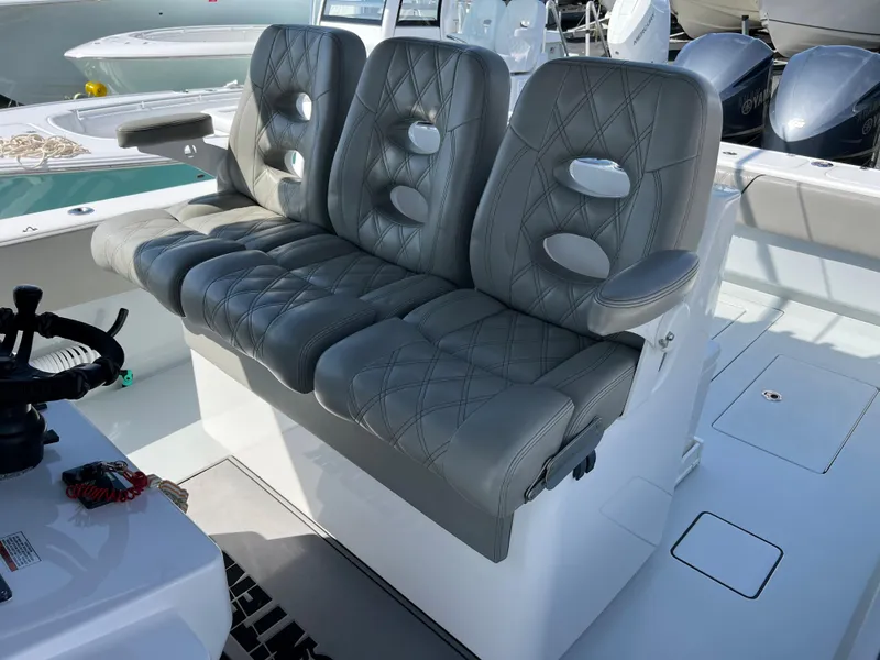 Slide: The Image of 2018 Contender 39 ST boat with gray leather seats. - 14