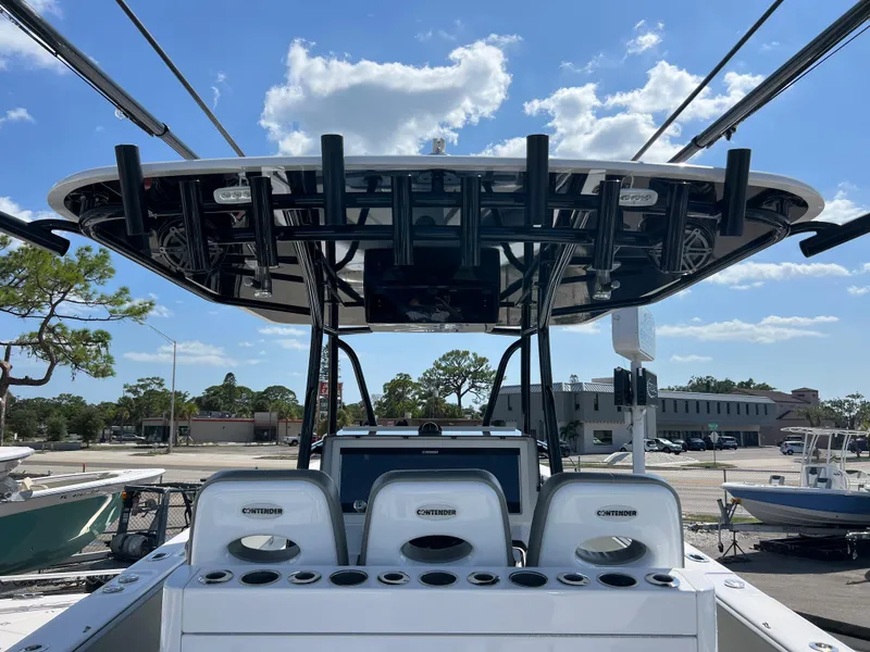 Slide: The Image of 2018 Contender 39 ST boat with T-top and seating at the harbor. - 16