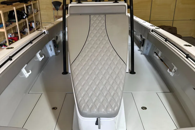 Slide: The Image of Interior view of a 2018 Contender 39 ST boat with padded seating. - 19