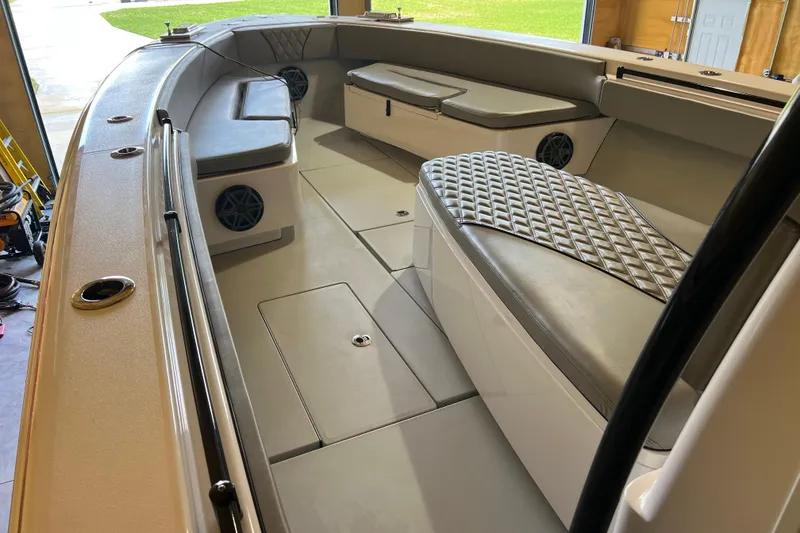 Slide: The Image of 2018 Contender 39 ST boat interior with cushioned seating and speakers. - 25