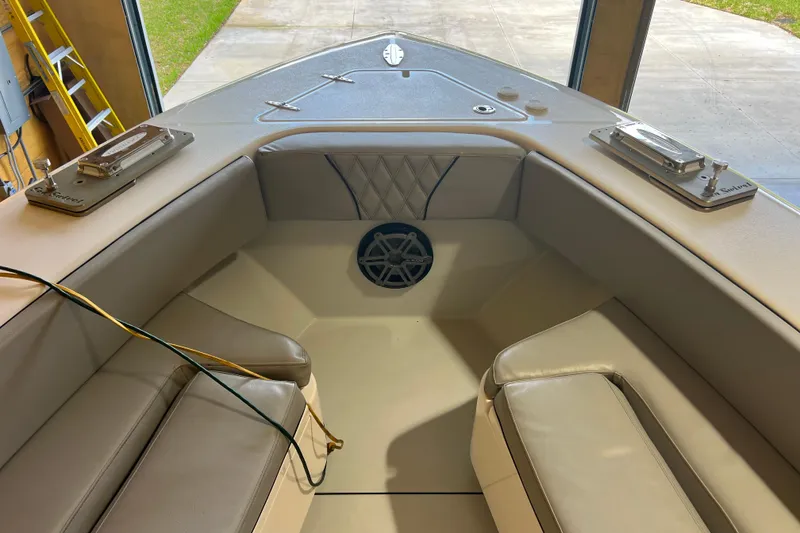 Slide: The Image of Interior view of 2018 Contender 39 ST boat with cushioned seating and speaker. - 26