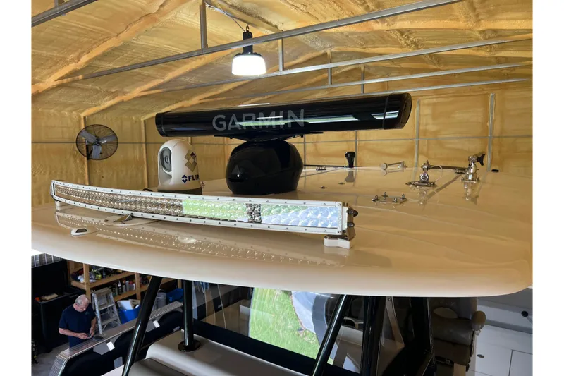 Slide: The Image of 2018 Contender 39 ST boat with Garmin and FLIR equipment in a garage. - 28