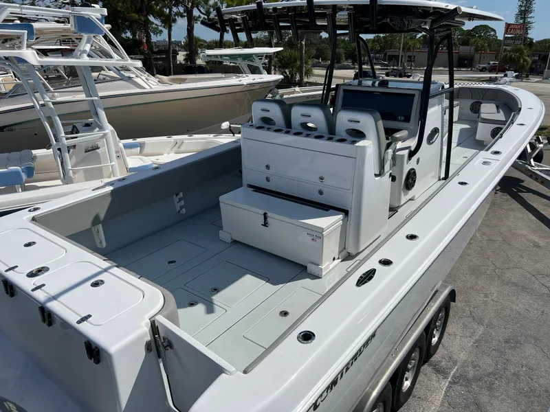 Slide: The Image of 2018 Contender 39 ST boat with spacious deck and seating area. - 6