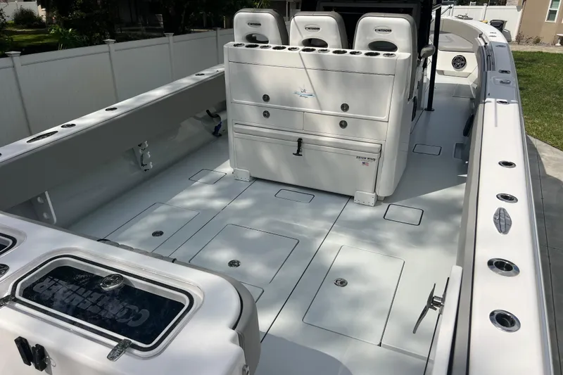 Slide: The Image of 2018 Contender 39 ST boat interior with seating and storage compartments. - 7