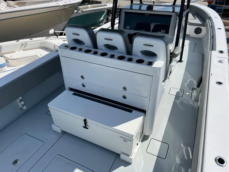 Slide: The Image of Interior view of a 2018 Contender 39 ST boat with seating and storage. - 8