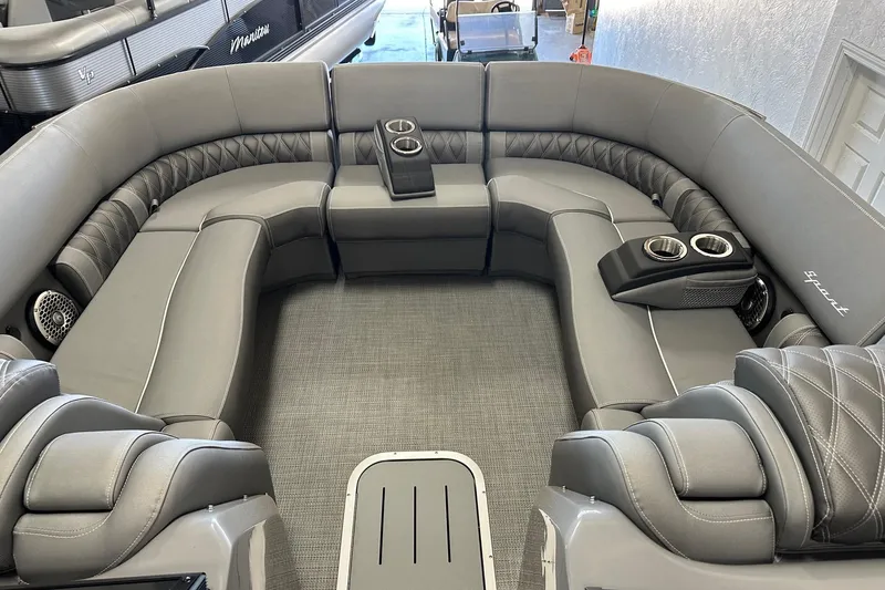 Slide: The Image of Luxurious interior of 2024 Bennington 25 QSBWA pontoon boat with plush seating and cup holders. - 23