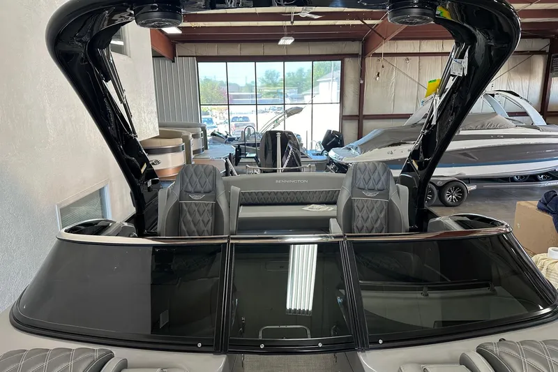 Slide: The Image of 2024 Bennington 25 QSBWA pontoon boat interior with luxury seating and sleek design. - 24