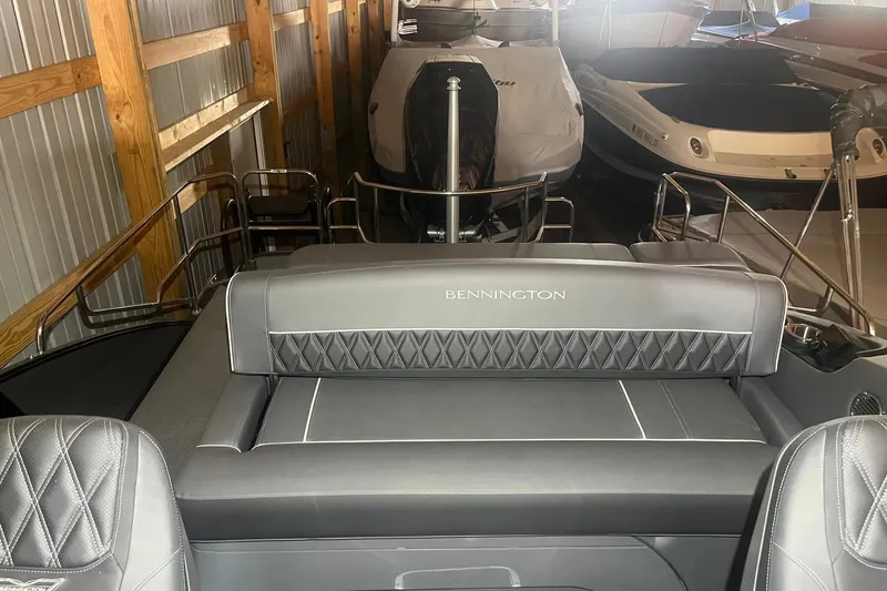 Slide: The Image of 2024 Bennington 25 QSBWA boat interior with luxurious seating in storage. - 34