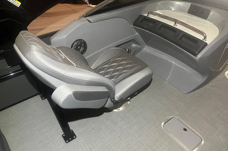 Slide: The Image of 2024 Bennington 25 QSBWA boat interior with gray seating and modern design. - 35
