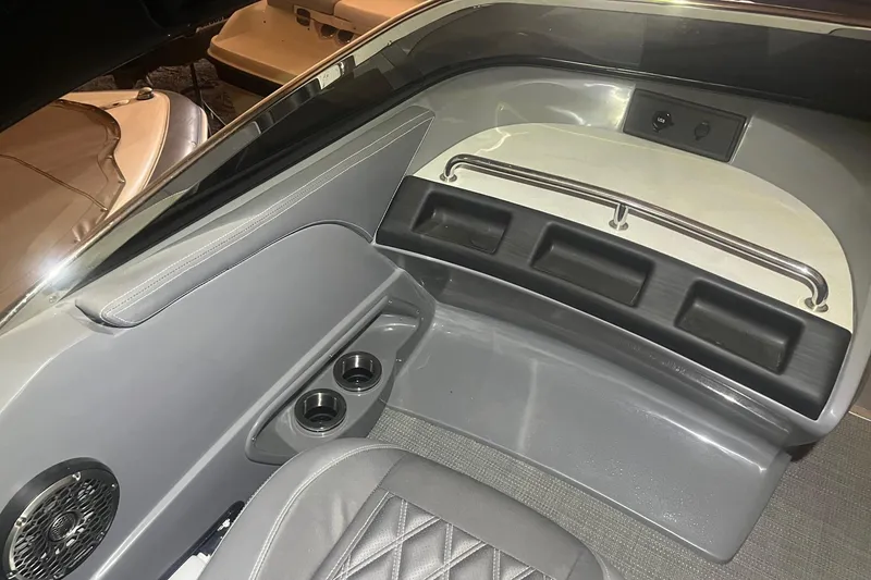 Slide: The Image of Interior of 2024 Bennington 25 QSBWA boat with cup holders and speaker. - 36