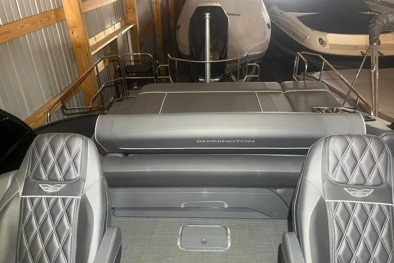 Slide: The Image of 2024 Bennington 25 QSBWA boat interior with luxurious seating and sleek design. - 46