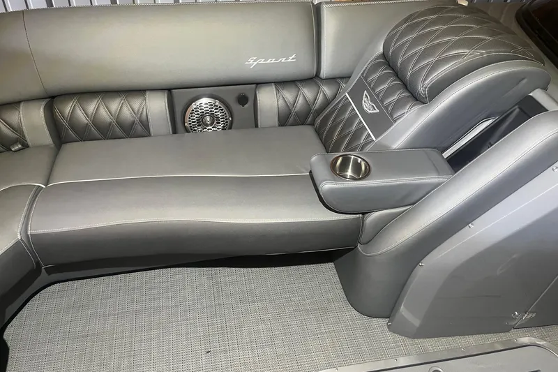 Slide: The Image of Luxurious seating in the 2024 Bennington 25 QSBWA boat, featuring diamond-stitched upholstery and cup holder. - 50