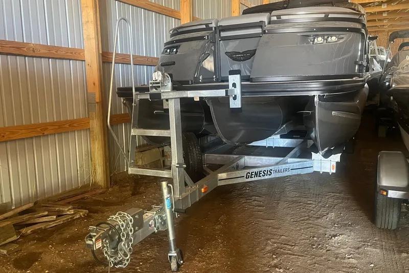 Slide: The Image of 2024 Bennington 25 QSBWA pontoon boat on Genesis trailer in storage shed. - 59