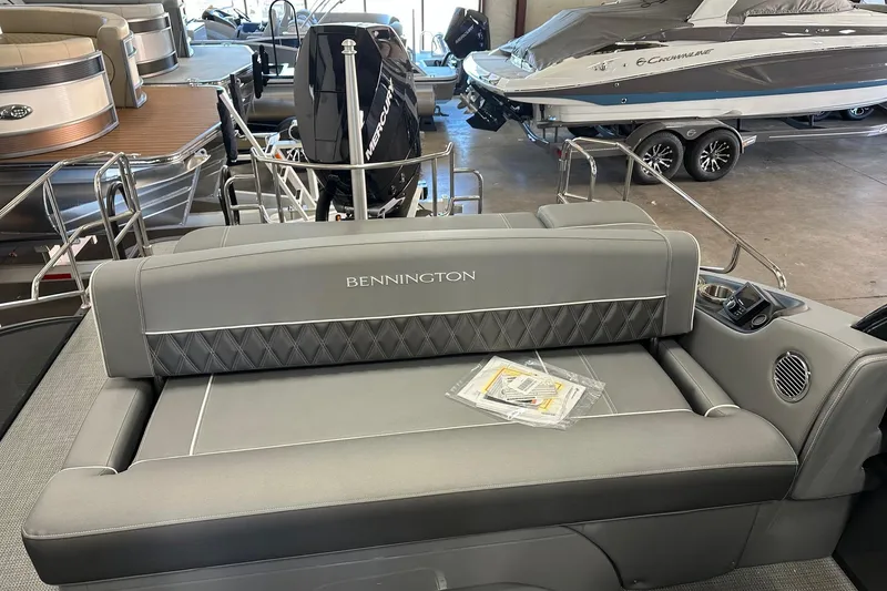 Slide: The Image of 2024 Bennington 25 QSBWA pontoon boat interior with luxurious seating and modern design. - 9