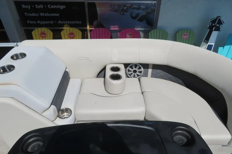Slide: The Image of Luxurious seating on a 2018 Bennington 23 SSRXP boat with cup holders and speaker. - 22