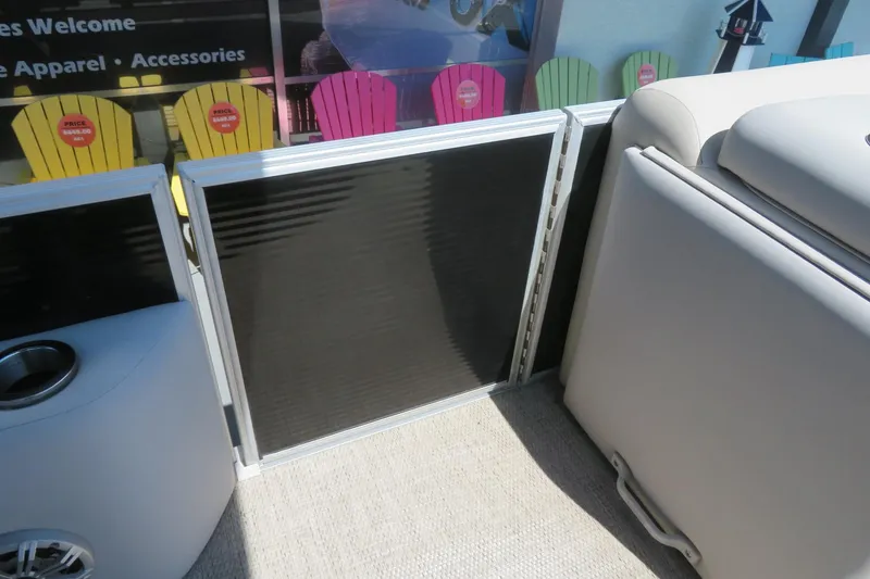Slide: The Image of Interior of a 2018 Bennington 23 SSRXP boat with seating and cup holder. - 25