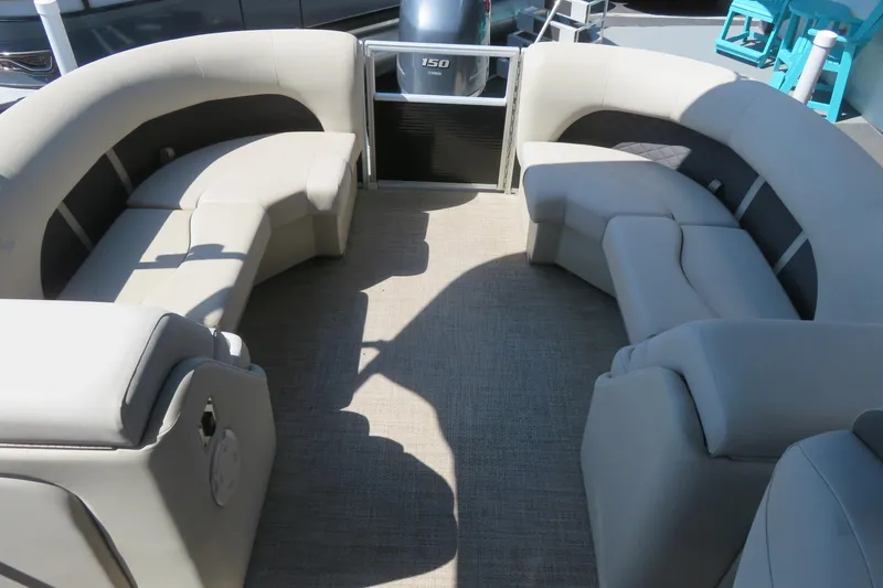 Slide: The Image of 2018 Bennington 23 SSRXP pontoon boat interior with beige seating and carpet flooring. - 27