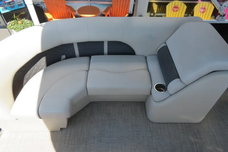 Slide: The Image of 2018 Bennington 23 SSRXP boat seating with cup holder, featuring plush, curved design. - 29