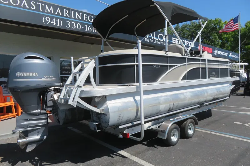Slide: The Image of 2018 Bennington 23 SSRXP pontoon boat with Yamaha engine on trailer. - 3