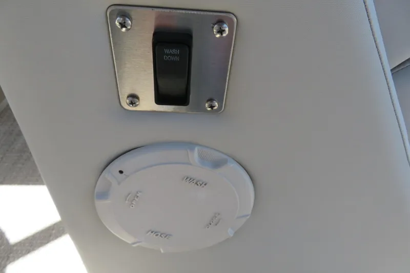 Slide: The Image of Switch and hose port on 2018 Bennington 23 SSRXP boat interior. - 33