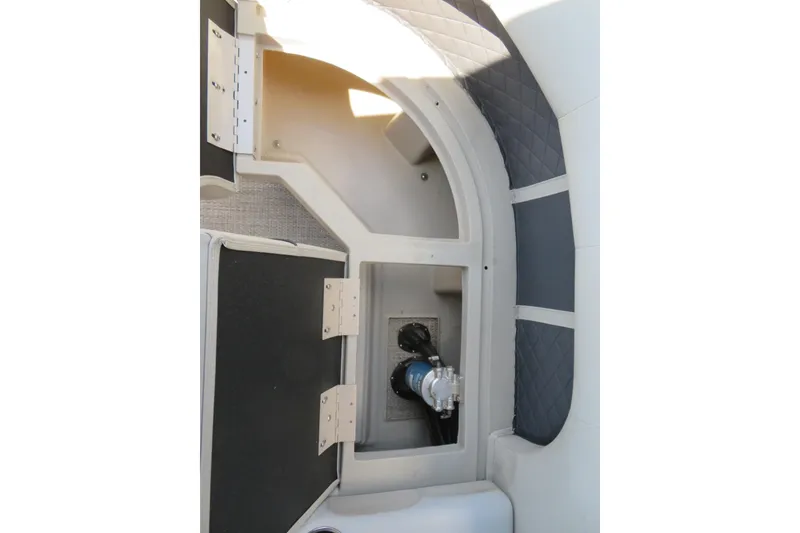 Slide: The Image of Interior storage compartment of a 2018 Bennington 23 SSRXP boat, featuring quilted paneling. - 37