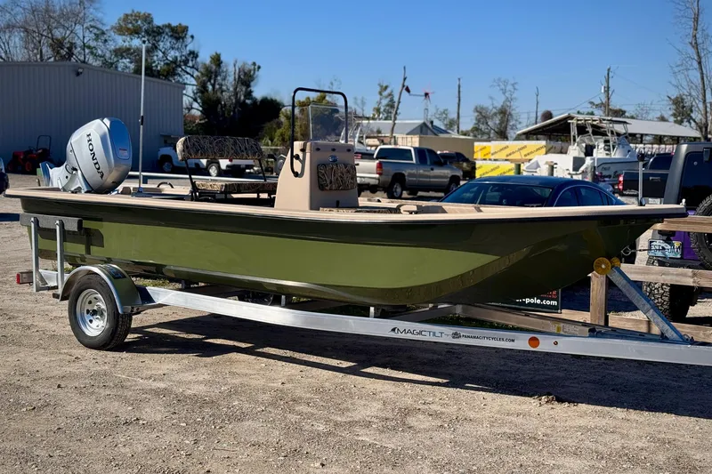 The Image of 2025 Carolina Skiff E20 JVX CC Sportsman Edition on trailer, featuring Honda outboard motor. - 0