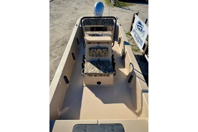 Slide: The Image of 2025 Carolina Skiff E20 JVX CC SPORTSMAN EDITION boat interior with camouflage seating. - 10