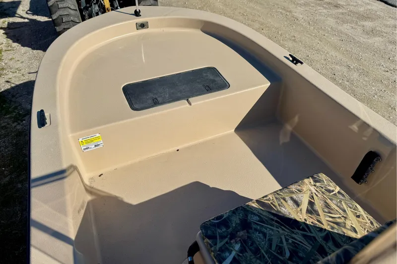 Slide: The Image of 2025 Carolina Skiff E20 JVX CC SPORTSMAN EDITION boat interior with storage compartment. - 14