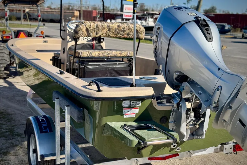 Slide: The Image of 2025 Carolina Skiff E20 JVX CC SPORTSMAN EDITION boat with powerful outboard motor. - 17