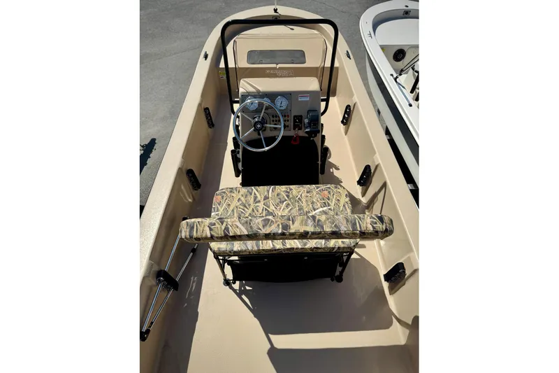 Slide: The Image of 2025 Carolina Skiff E20 JVX CC SPORTSMAN EDITION boat interior with camouflage seating. - 18