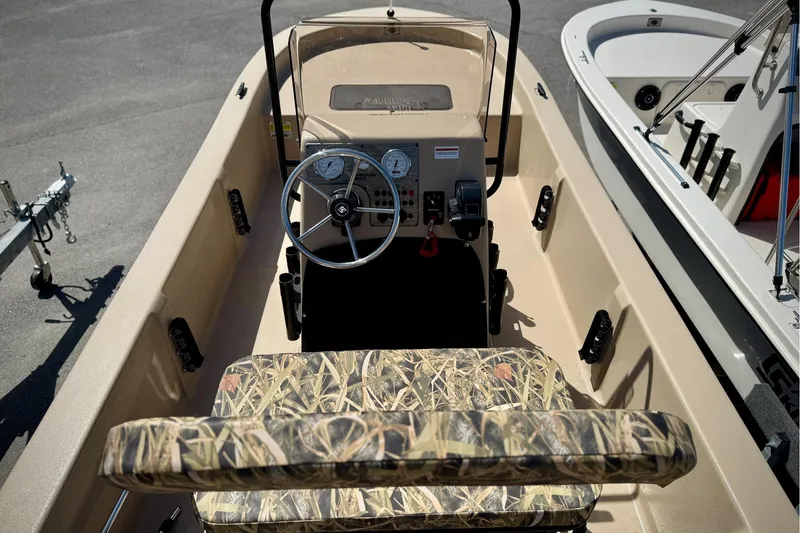 Slide: The Image of 2025 Carolina Skiff E20 JVX CC SPORTSMAN EDITION boat interior with camouflage seating. - 19