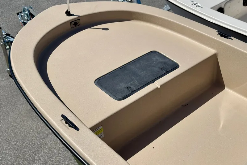 Slide: The Image of 2025 Carolina Skiff E20 JVX CC SPORTSMAN EDITION boat deck with storage compartment. - 20