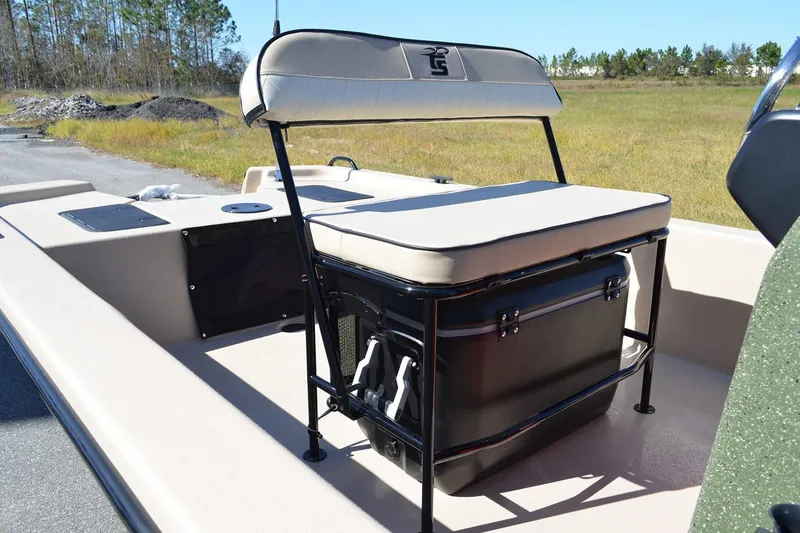 Slide: The Image of Manufacturer Provided Image: 2026 Carolina Skiff E20 JVX CC boat interior with cushioned seating and storage. - 26