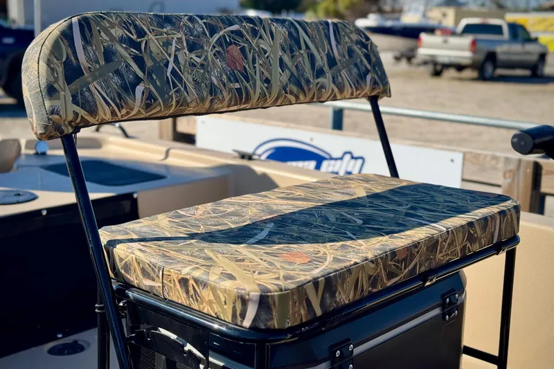 Slide: The Image of 2025 Carolina Skiff E20 JVX CC SPORTSMAN EDITION boat seat with camouflage pattern. - 3