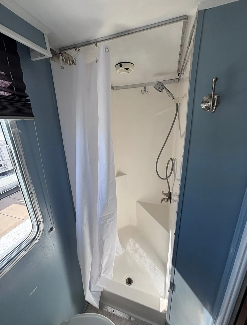 Slide: The Image of Shower in a 1992 Gibson Sport RV. - 7