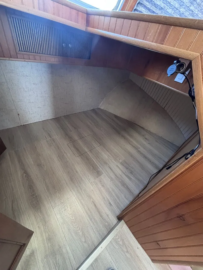 Slide: The Image of Interior of a 1992 Gibson Sport boat with wood paneling. - 8