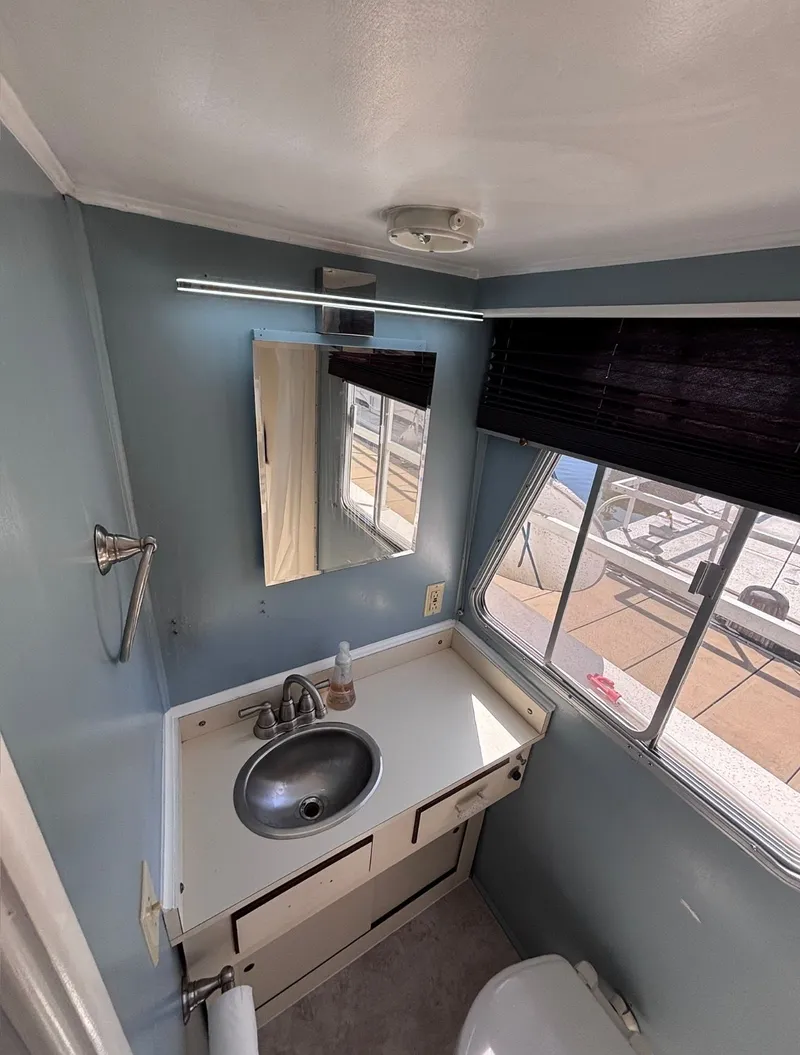 Slide: The Image of Compact bathroom in a 1992 Gibson Sport boat. - 9