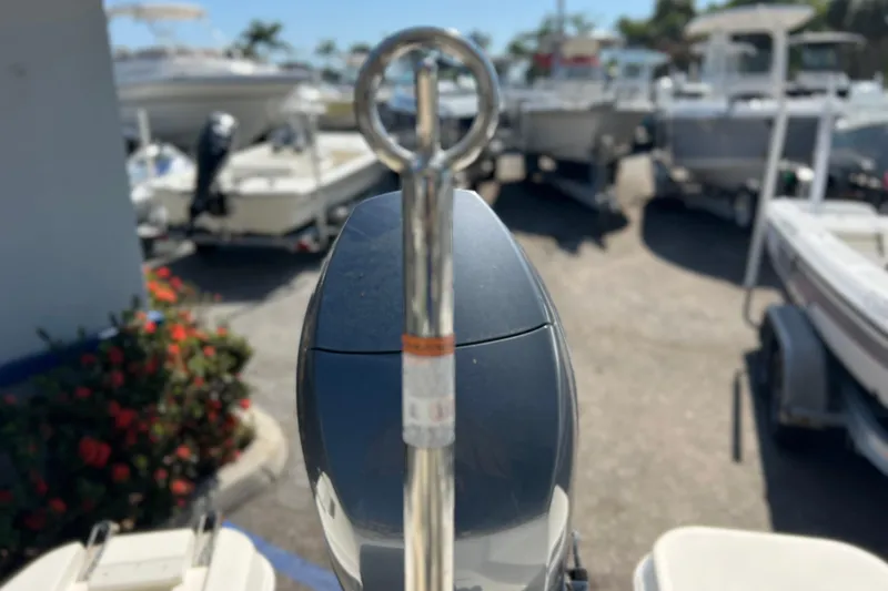 Slide: The Image of 2017 Stingray 182 SC boat motor with eye bolt, surrounded by other boats in a marina. - 13