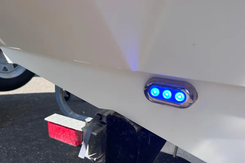Slide: The Image of 2017 Stingray 182 SC boat with blue LED lights on the hull. - 29